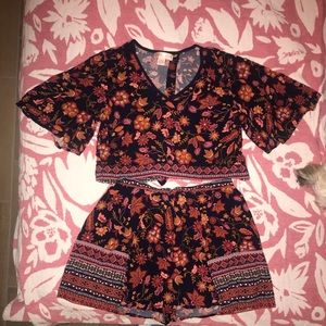 Two piece, high wasted skort/ open back top.